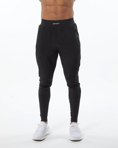 Alphalete Woven 4-Way Stretch 29" Pant Blackout | 91243BESZ